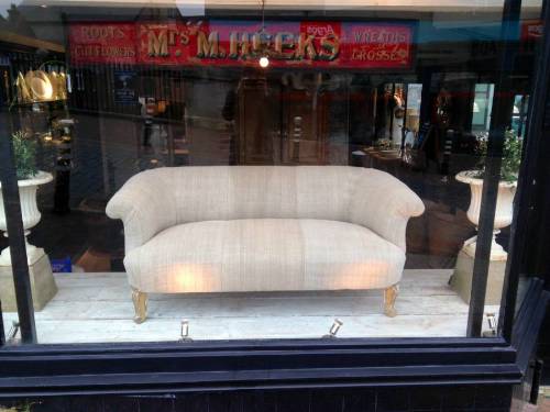 Two seater sofa with gilt Legs
